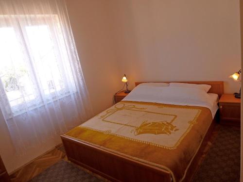 Postel nebo postele na pokoji v ubytování Apartments Jelka