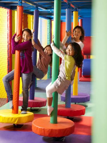 a group of children playing on a playground at Shangri-La Barr Al Jissah, Muscat in Muscat
