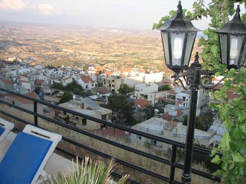 a street light with a view of a city at Hill View Hotel Apartments in Pissouri