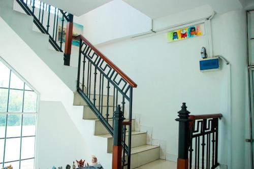 a staircase in a house with a stair case at White House in Wattala