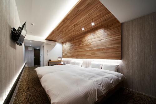 Postel nebo postele na pokoji v ubytování Carta Hotel Kyoto Bettei