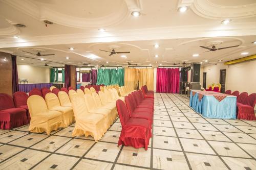 a room with rows of chairs and a table at WOW STAYZ2 Hotel Jahanvi Dale in Haridwār