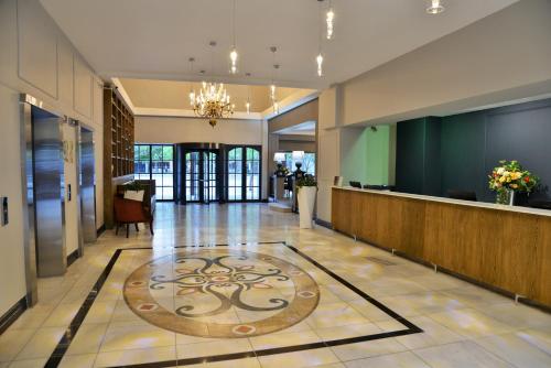 a lobby with a large rug on the floor at The Capetonian - Halaal in Cape Town