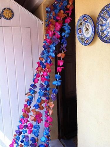 a bunch of stuffed animals hanging on a wall at B&B Il Vicolo Di Pizzo in Pizzo