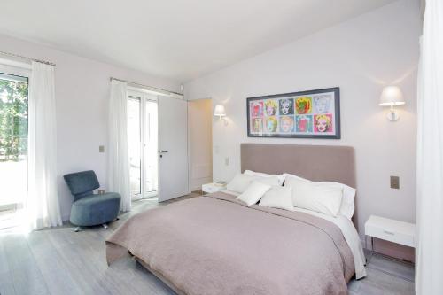 Säng eller sängar i ett rum på Crispi Luxury Apartments - My Extra Home