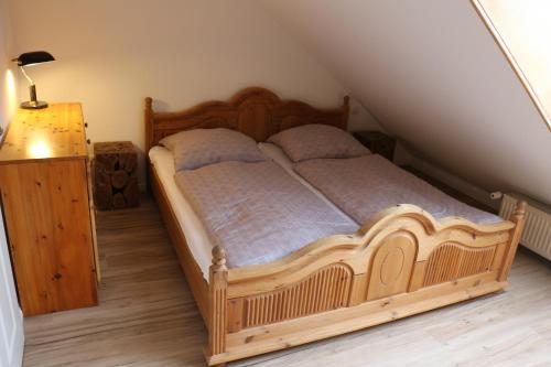 Postel nebo postele na pokoji v ubytování Mitten in Braunlage mit tollem Ausblick, inclusive Netflix