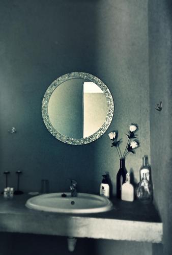a bathroom with a sink and a mirror at Vastrap Guest Farm in Grünau