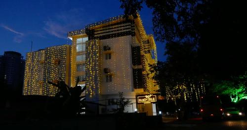 a building with a lot of lights on it at Eden Isle Luxury Service Apartment in Cochin