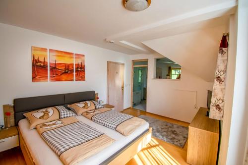 a bedroom with a large bed in a room at Villa Salza in Sankt Martin am Grimming