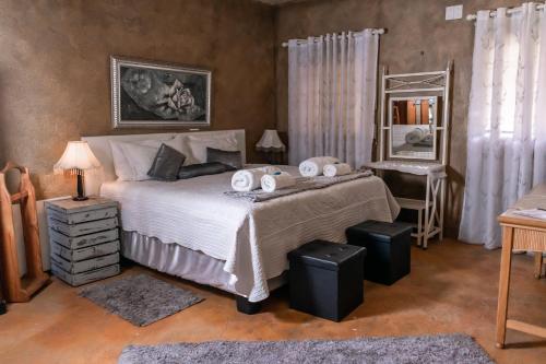Katil atau katil-katil dalam bilik di Bastille de Blignaut B&B