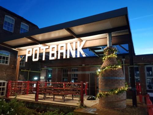 a building with a sign on the front of it at Potbank in Stoke on Trent