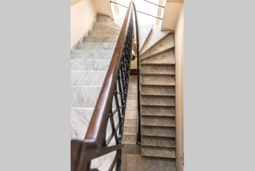 a spiral staircase in a building with a stair railing at Casa Rubinacci in Naples