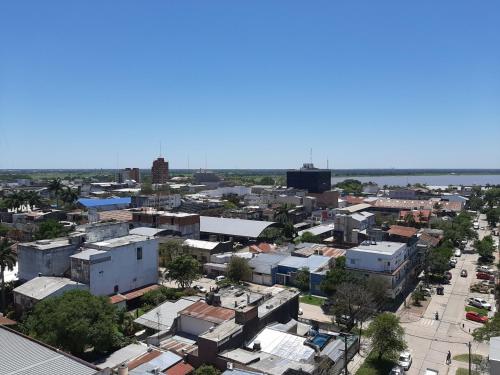 an aerial view of a city with buildings and a river at TODO EL CENTRO A TUS PIES in Formosa