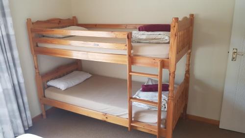 Postel nebo postele na pokoji v ubytování Elfransa Beach Cottage