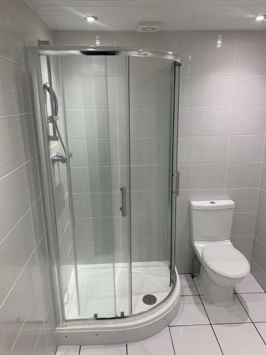 a bathroom with a shower and a toilet at Hagley Hotel in Birmingham