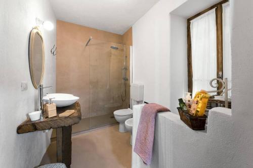 a bathroom with a sink and a toilet and a shower at Al vicolo del Gallo APPARTAMENTO in Varallo