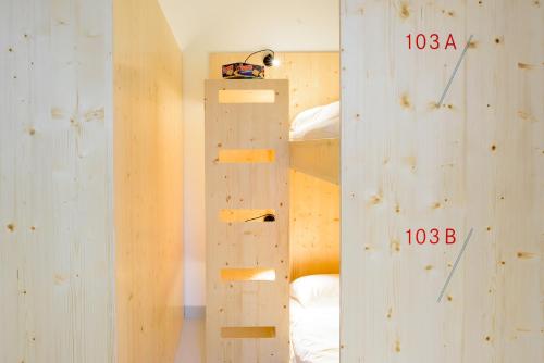 a room with a wall with a climbing wall at The Green Elephant Hostel & Spa in Maastricht