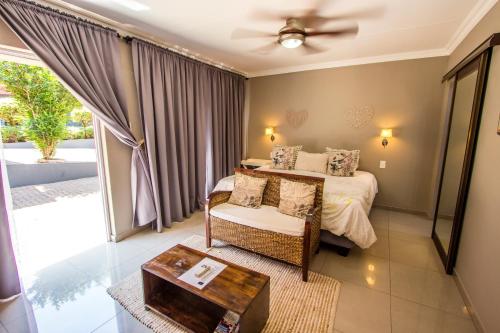 Ένα ή περισσότερα κρεβάτια σε δωμάτιο στο New Bali Guesthouse
