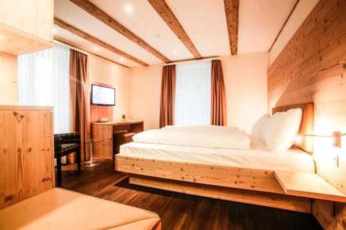 a bedroom with a bed in a room at Gasthaus zur Waldegg in Luzern