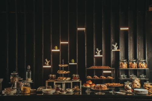 a table with many different types of food on it at Alba Palace Hotel in Favara