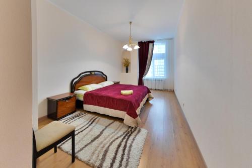 Tempat tidur dalam kamar di Apartment На водно-зеленом бульваре