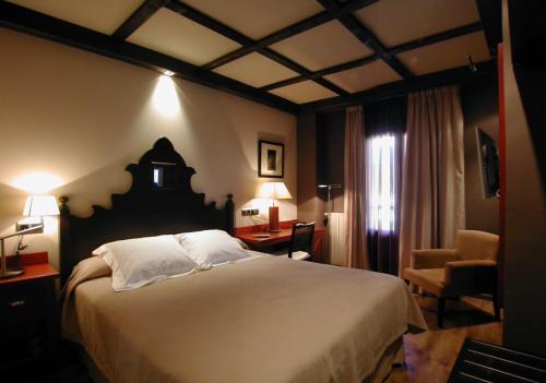 Postel nebo postele na pokoji v ubytování Hotel Ciria