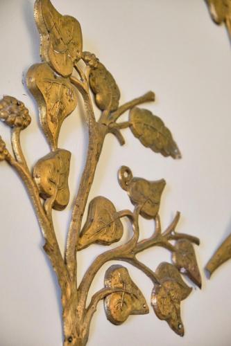 a brass tree with leaves and birds on it at Casa Rubinacci in Naples