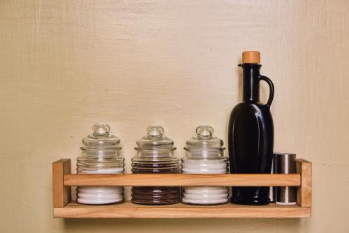 a shelf with plates and a bottle on it at Casa Rubinacci in Naples