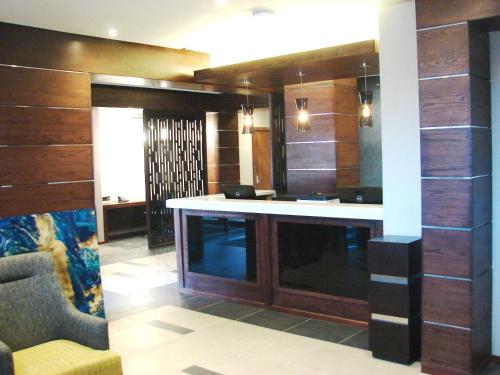 a large room with a bar in the middle at Premier Splendid Inn Bloemfontein in Bloemfontein