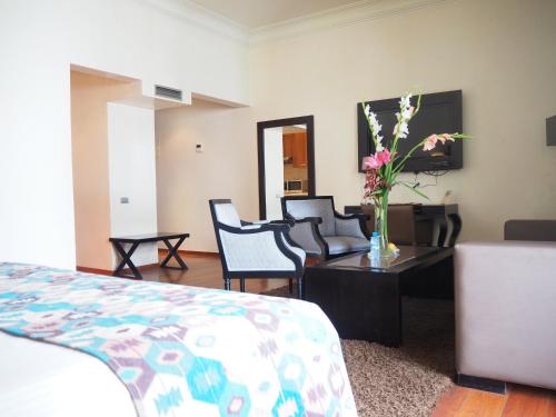 Ein Bett oder Betten in einem Zimmer der Unterkunft Park Suites Hotel Luxury Boutique Hotel