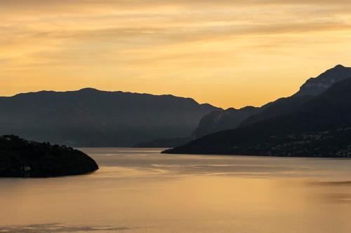 a view of a lake with mountains in the background at La Collina dei Fiori in Vercana