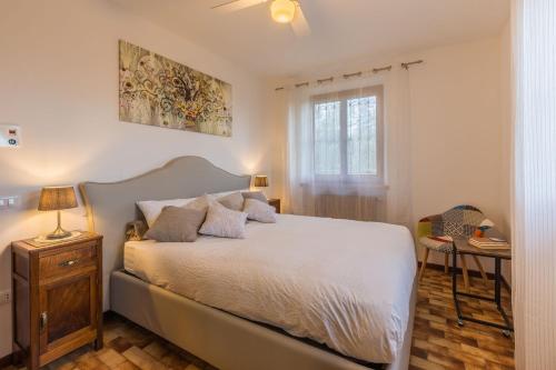 Ένα ή περισσότερα κρεβάτια σε δωμάτιο στο Agriturismo Villa Beatrice