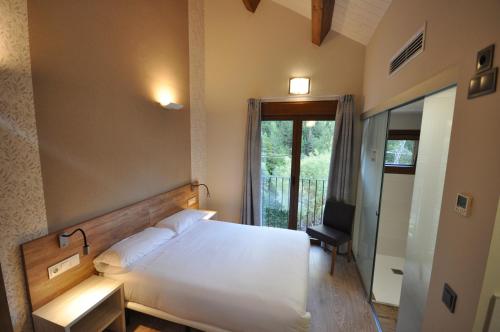 Postel nebo postele na pokoji v ubytování Camping Valle de Bujaruelo