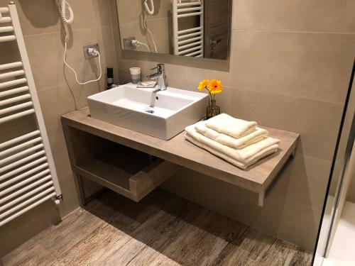 a bathroom with a white sink and a mirror at Il Feudo Di Agnadello in Agnadello