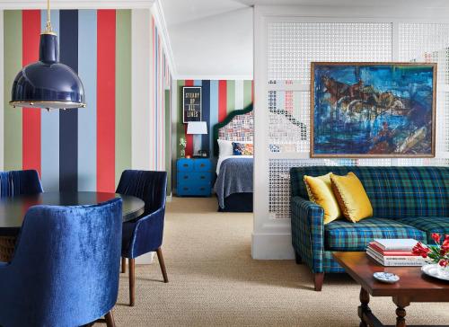 a living room with a couch and a table at Graduate by Hilton Annapolis in Annapolis
