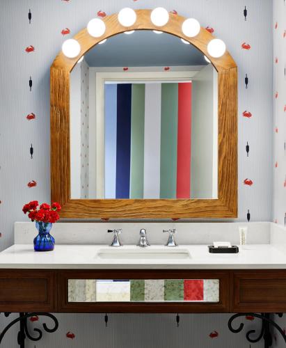 a bathroom with a sink and a mirror at Graduate by Hilton Annapolis in Annapolis