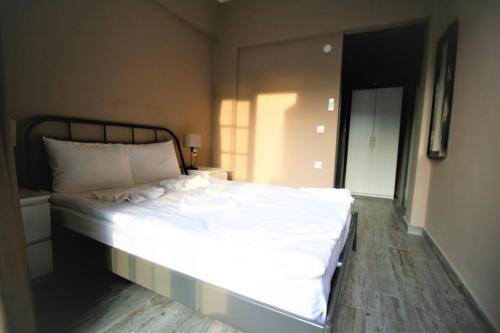 a bedroom with a large white bed in a room at Archeo in Istanbul