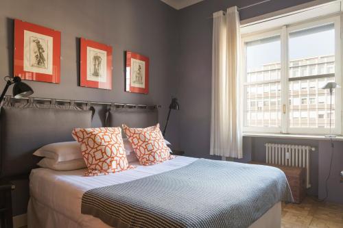 Tempat tidur dalam kamar di Milano Charming Apartment