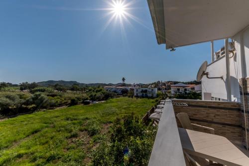 a view from the balcony of a house at Chandris Apartments in Kavos