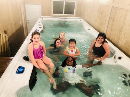 a group of people sitting in a hot tub at Orr Family Farm & RR, LLC in Oklahoma City