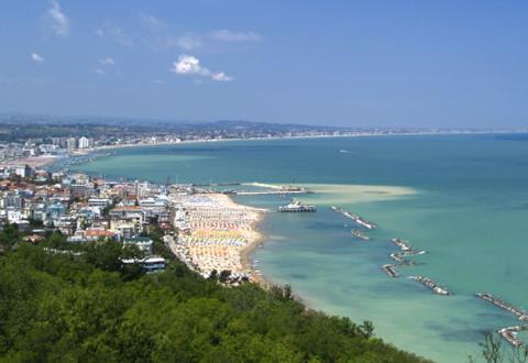 a view of a beach with boats in the water at Grand Hotel Michelacci in Gabicce Mare