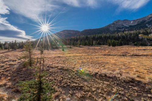 a large open field with the sun in the sky at Snowcreek V 756 in Mammoth Lakes