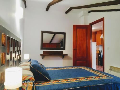 Un pat sau paturi într-o cameră la Ático19