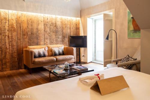 a living room with a couch and a table at Dare Lisbon House in Lisbon
