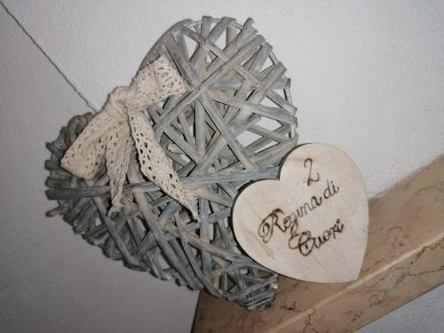 a metal heart with a heart with aactedactedactedactedactedactedactedacted at Cà Reginella B&B in Diano dʼAlba