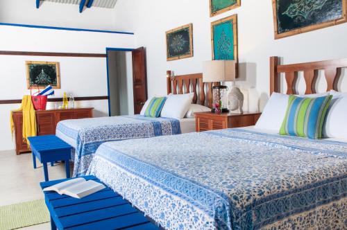 Postel nebo postele na pokoji v ubytování Blue Osa Beach Resort & Spa