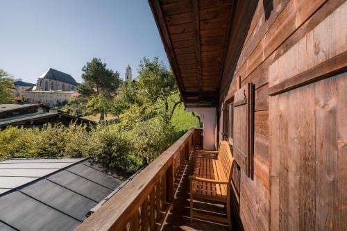 a balcony of a house with a wooden wall at Chalet am Hasensprung in Berchtesgaden
