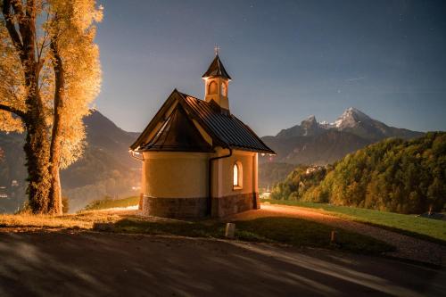 a small church on the side of a road at Chalet am Hasensprung in Berchtesgaden