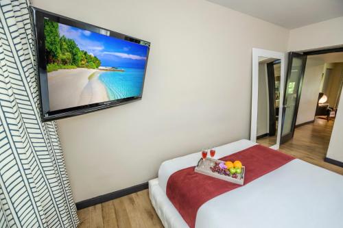 Postel nebo postele na pokoji v ubytování Metropole Suites South Beach