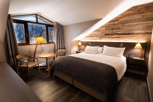 Tempat tidur dalam kamar di Hotel Termas Chillán